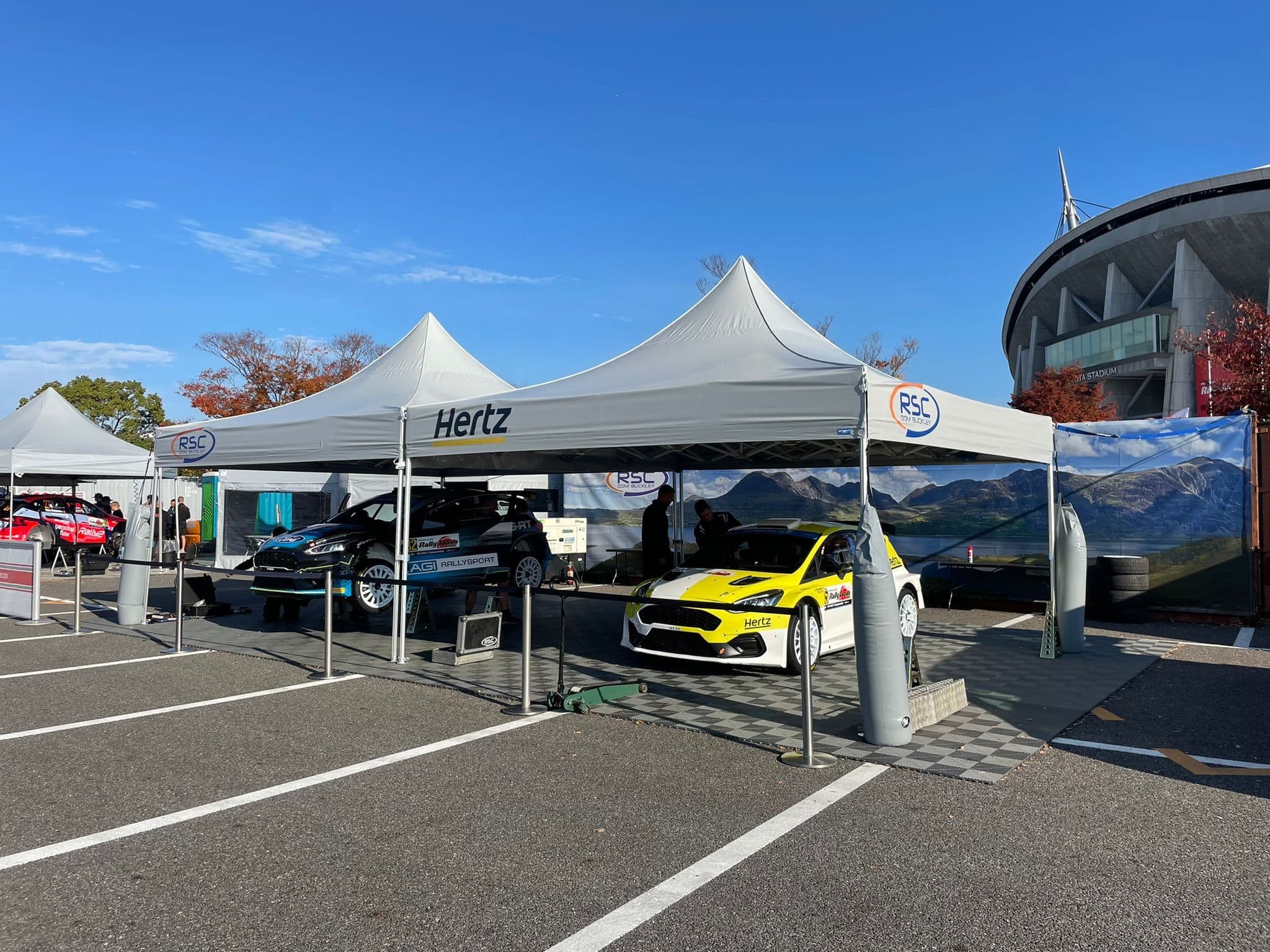 Professional pop-up tent used at an outdoor motorsport event